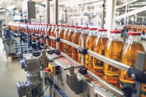 A bottling facility filling bottles with liquid