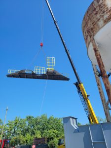 A crane lifting a piece of equipment
