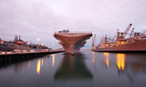 Large ships docked in a naval yard